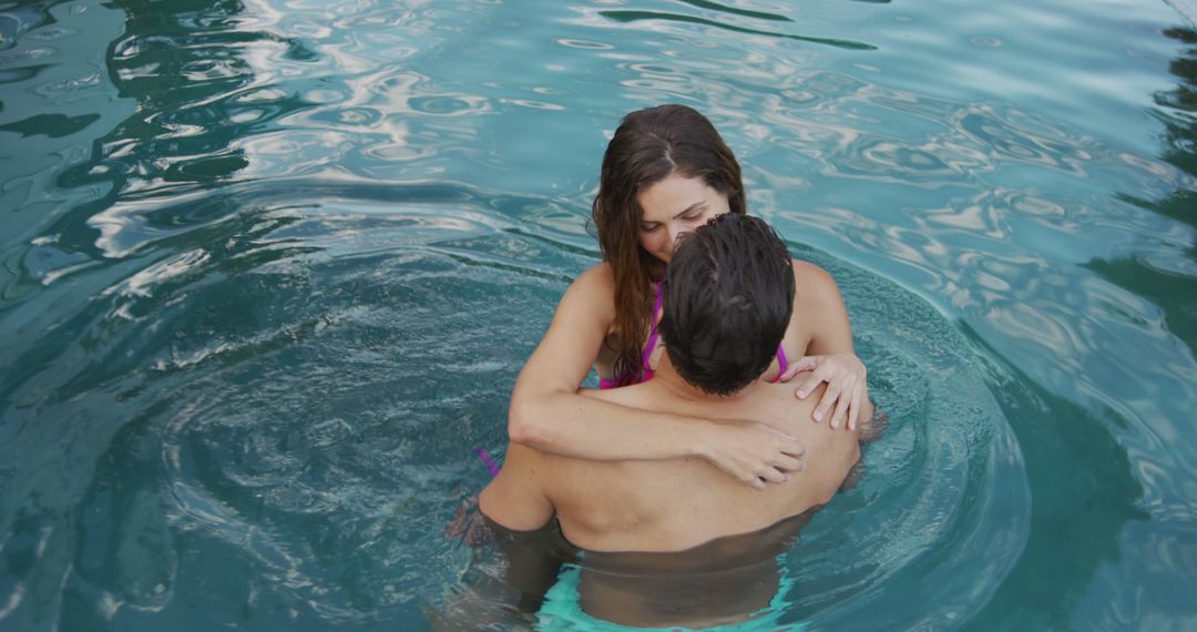 Romantic Couple Embracing in Pool - Free Images, Stock Photos and Pictures on Pikwizard.com