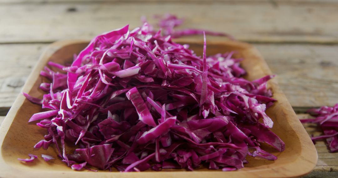 Pile of Shredded Red Cabbage on Wooden Platter - Free Images, Stock Photos and Pictures on Pikwizard.com