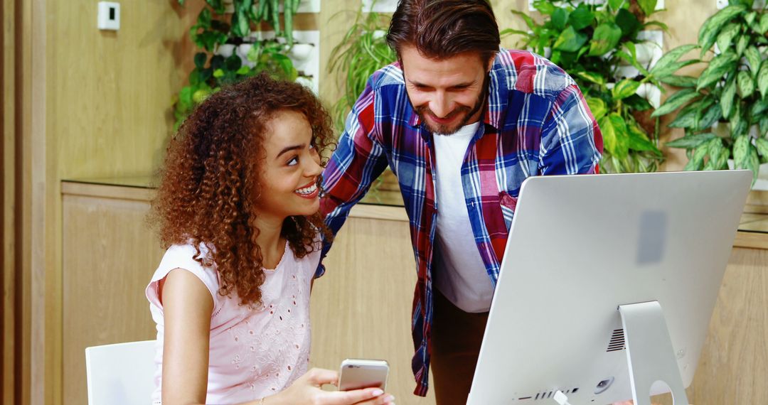 Colleagues Collaborating in Modern Office with Smart Technology