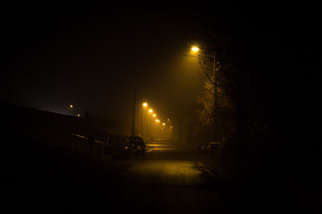 Misty Night Street Lit by Dim Street Lamps - Free Images, Stock Photos and Pictures on Pikwizard.com