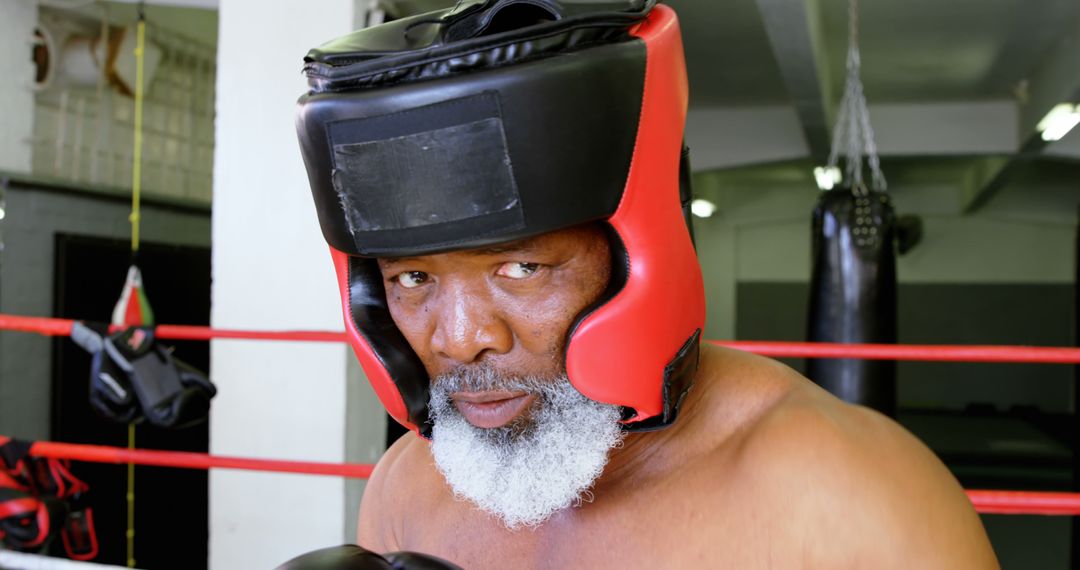 Senior Boxer Wearing Protective Gear in a Gym - Free Images, Stock Photos and Pictures on Pikwizard.com