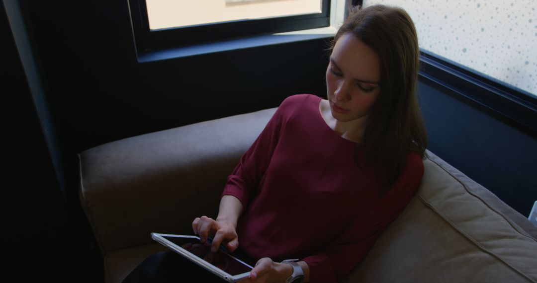 Woman Using Tablet in Modern Office - Free Images, Stock Photos and Pictures on Pikwizard.com