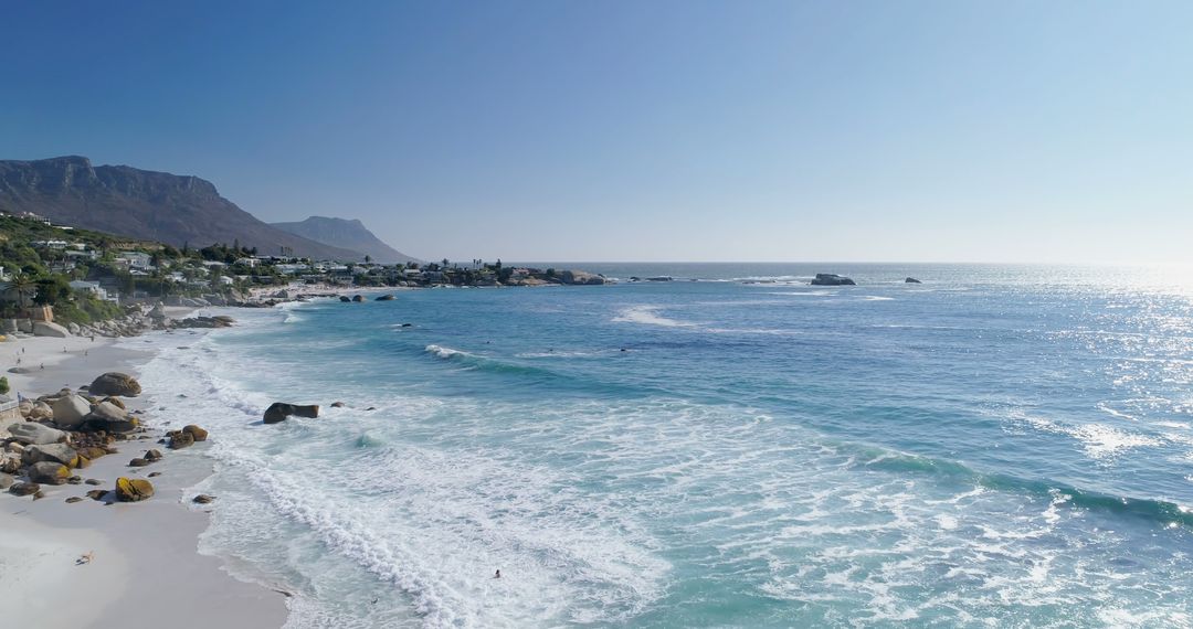 Scenic Cape Town Beach with Distant Mountains at Sunrise - Free Images, Stock Photos and Pictures on Pikwizard.com