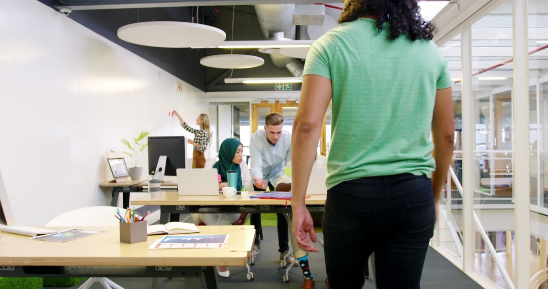 Diverse Team Engaging in Collaborative Office Brainstorming