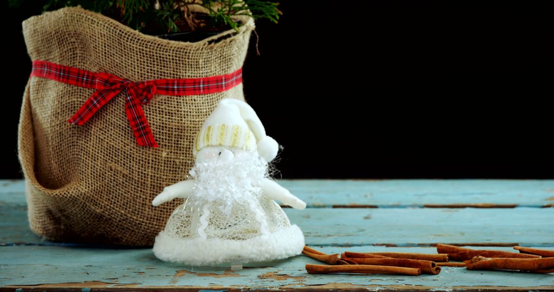 Rustic Christmas Arrangement with Santa Ornament on Wooden Table - Free Images, Stock Photos and Pictures on Pikwizard.com