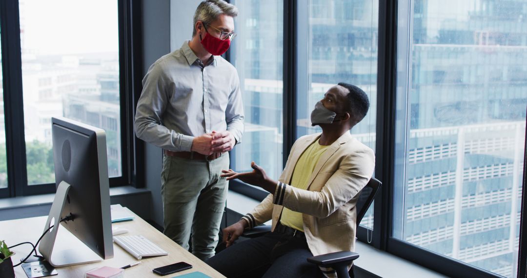 Businessmen Collaborating in Modern Office While Wearing Face Masks - Free Images, Stock Photos and Pictures on Pikwizard.com