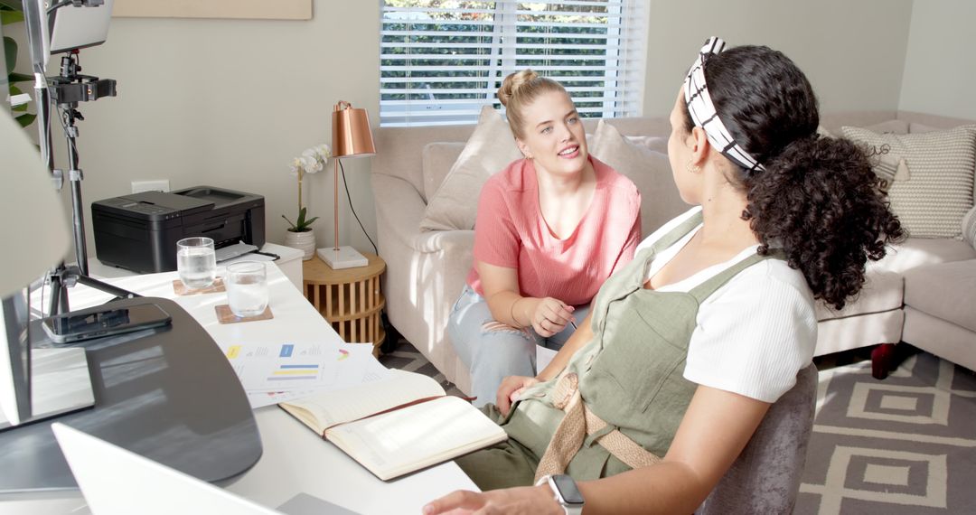 Diverse Female Colleagues Collaborating in Home Office Setting
