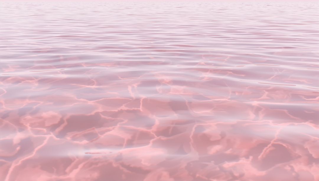 Glistening Pink Ocean Surface Creating Pastel Ripples and Tranquil Reflections