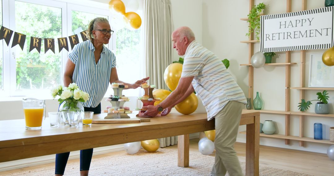 Senior Friends Celebrating Retirement with Snacks and Drinks