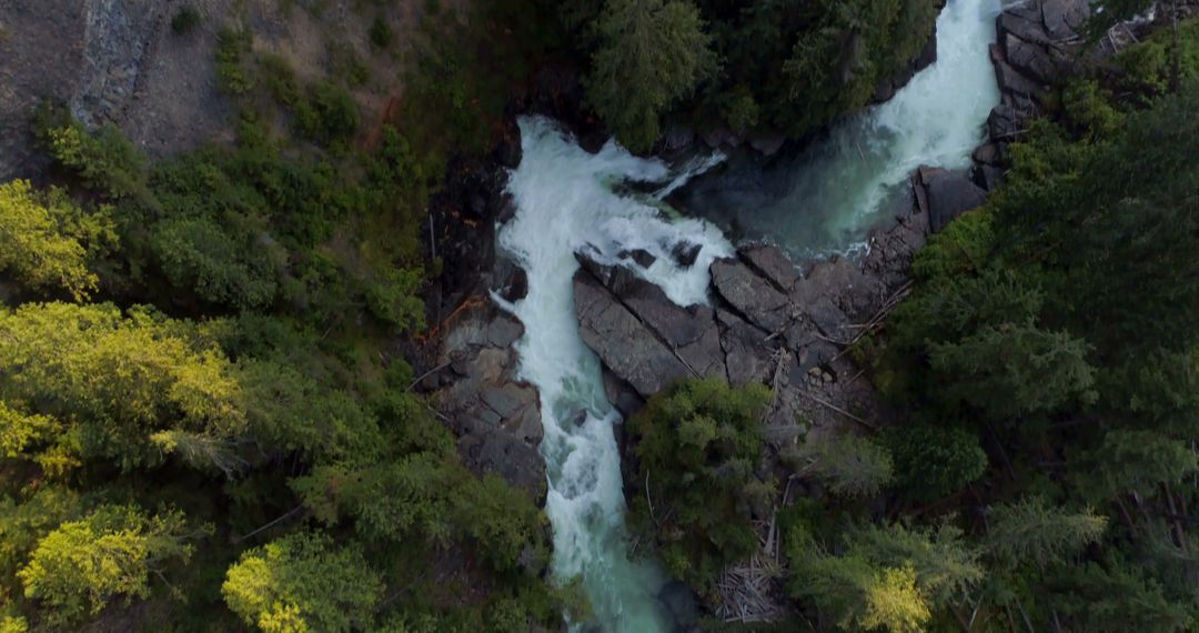 Aerial View of Rapid River Flowing Through Forest with Rock Formations - Free Images, Stock Photos and Pictures on Pikwizard.com