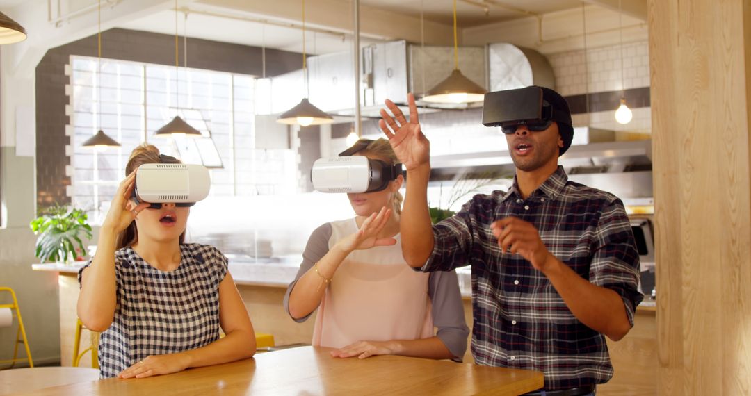 Diverse Group in Kitchen Wearing VR Headsets and Exploring Virtual World - Free Images, Stock Photos and Pictures on Pikwizard.com