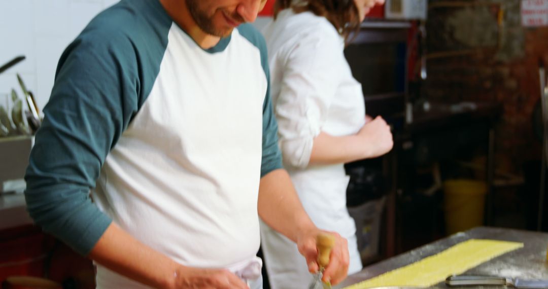 Chefs preparing dough in commercial kitchen for culinary art - Free Images, Stock Photos and Pictures on Pikwizard.com