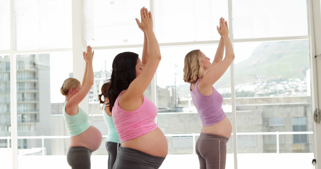 Pregnant Women Practicing Yoga in Modern Fitness Studio - Free Images, Stock Photos and Pictures on Pikwizard.com