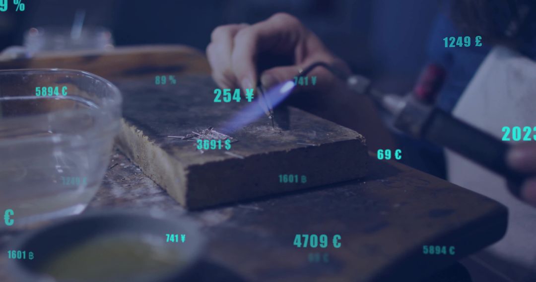 Craftsman Heating Metal with Torch on Workbench Showing Currency Symbols