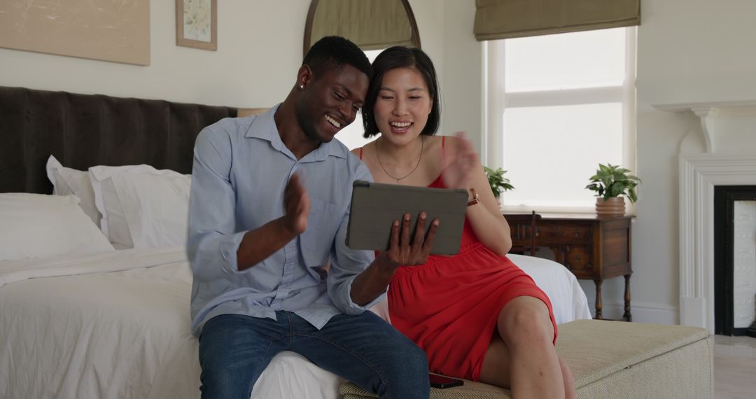 Diverse Couple Enjoying Technology Together in Modern Home Setting