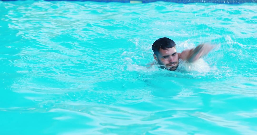 Young Man Swimming in Pool with Clear Blue Water - Free Images, Stock Photos and Pictures on Pikwizard.com