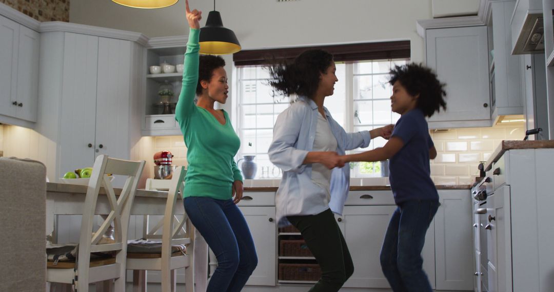 Happy Family Dancing Together in Kitchen at Home - Free Images, Stock Photos and Pictures on Pikwizard.com