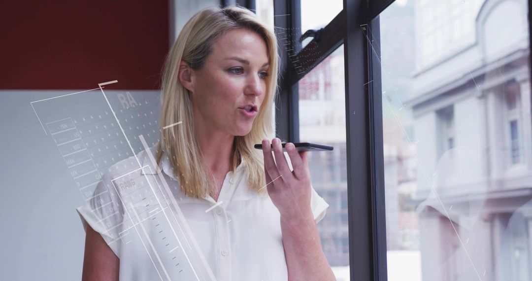 Executive Woman Using Voice Command Technology in Modern Office