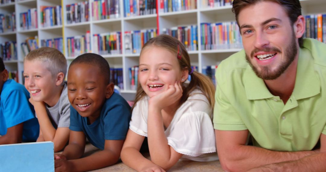 Teacher Reading Storybook to Smiling Diverse Children in Library - Free Images, Stock Photos and Pictures on Pikwizard.com