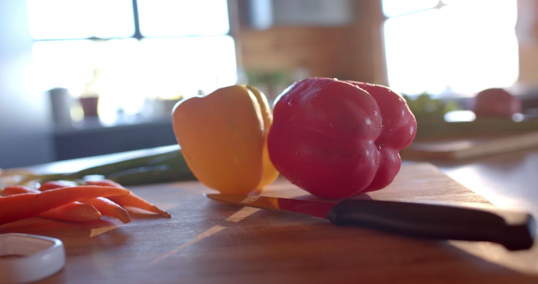 Bright Sunlit Kitchen with Fresh Vegetables on Cutting Board - Free Images, Stock Photos and Pictures on Pikwizard.com