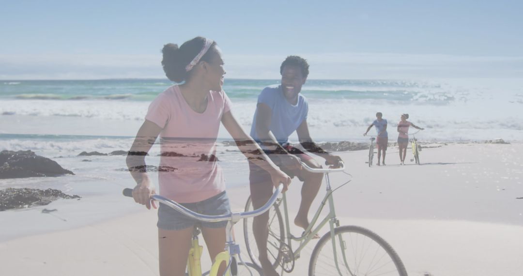 Couple Enjoying Beach Bicycle Ride on Sunny Day