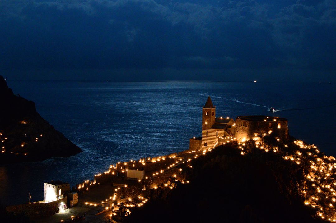 Magical Night View of Medieval Castle Lit by Lights on Sea Cliff - Free Images, Stock Photos and Pictures on Pikwizard.com