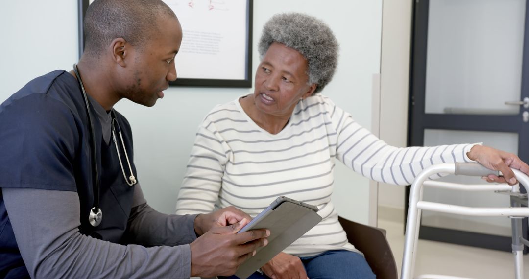 Nurse Conversing with Senior Woman in Medical Facility - Free Images, Stock Photos and Pictures on Pikwizard.com