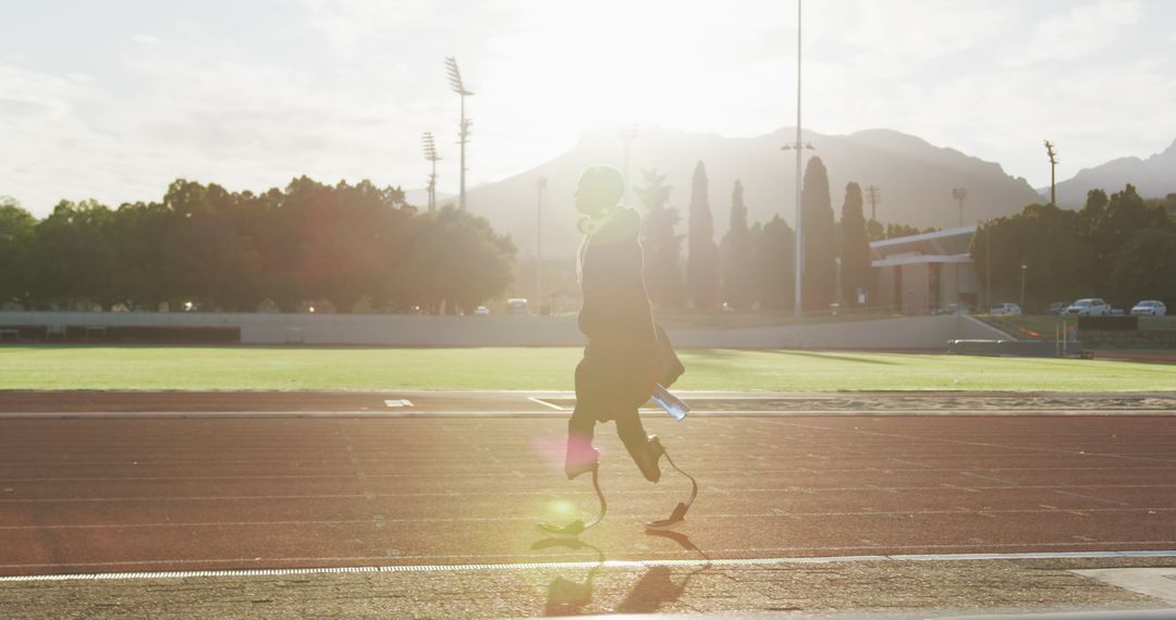 Para-athlete With Prosthetic Legs Running at Sunset on Track - Free Images, Stock Photos and Pictures on Pikwizard.com