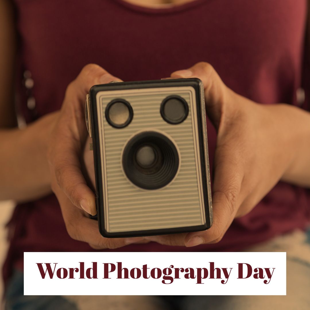 Close-up Hands Holding Retro Box Camera Celebrating World Photography Day