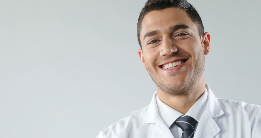 Smiling Male Doctor in Lab Coat and Tie - Free Images, Stock Photos and Pictures on Pikwizard.com