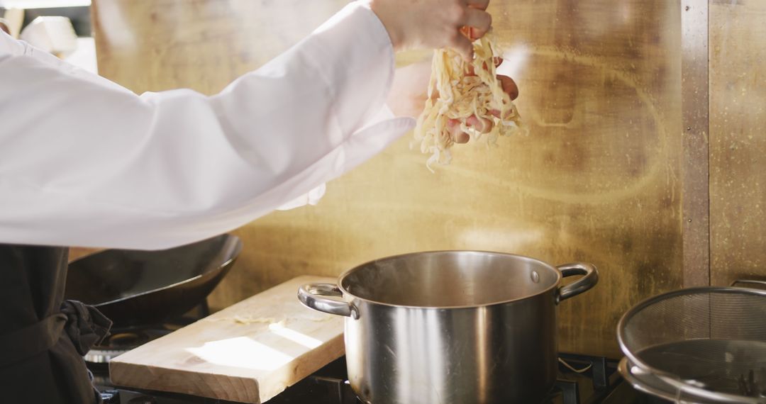 Chef Preparing Pasta in Professional Kitchen - Free Images, Stock Photos and Pictures on Pikwizard.com