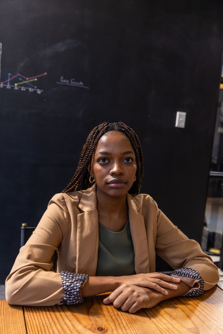 Professional Leader in Modern Office Environment with Graph Background