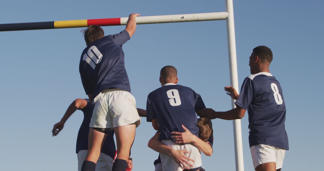 Group of Young Athletes Playing Rugby Outdoors in Daylight - Free Images, Stock Photos and Pictures on Pikwizard.com