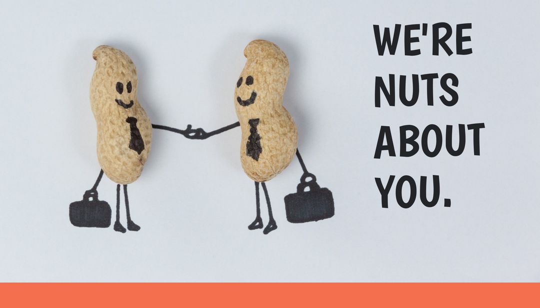 Two Peanuts Shaking Hands Symbolizing Friendship