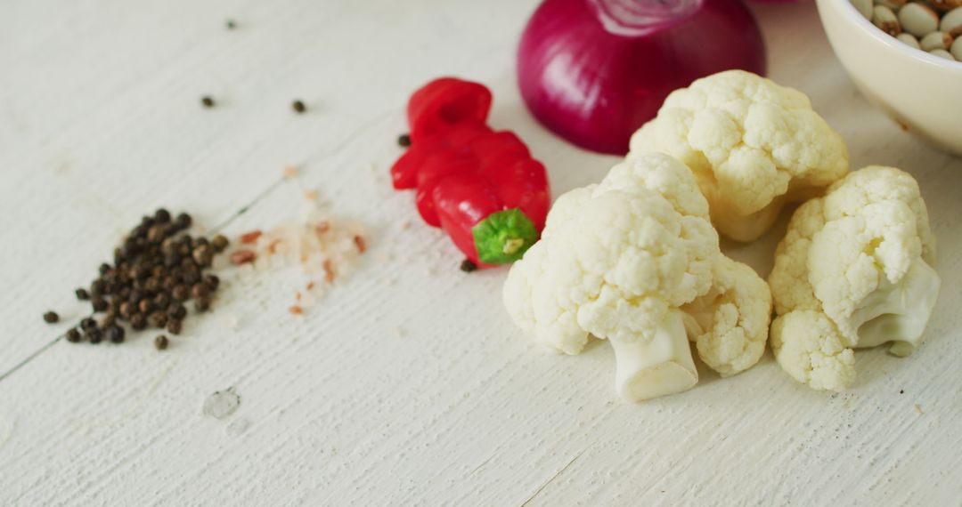 Fresh Cauliflower and Vegetables on Rustic White Table - Free Images, Stock Photos and Pictures on Pikwizard.com