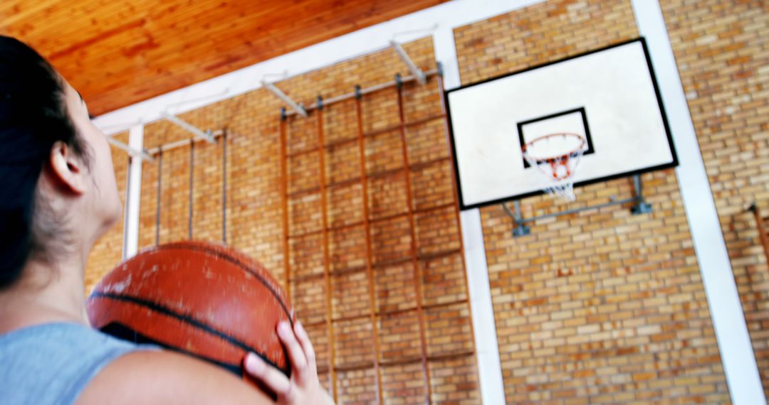 Young Woman Aiming Basketball Shot in Gym - Free Images, Stock Photos and Pictures on Pikwizard.com