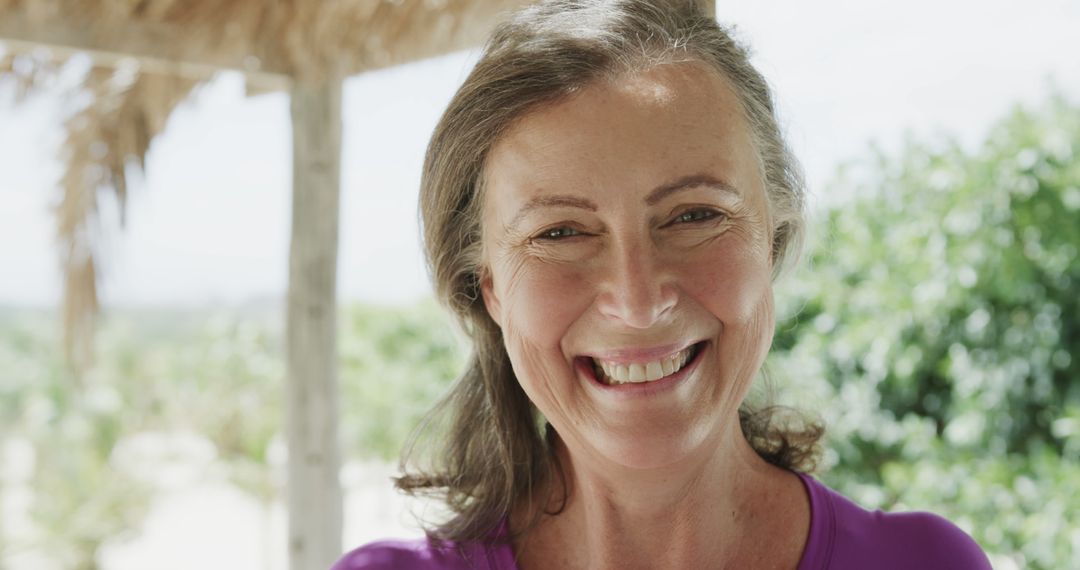 Smiling Middle-aged Woman Enjoying Outdoor Porch - Free Images, Stock Photos and Pictures on Pikwizard.com