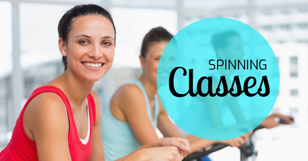 Smiling Woman Enthusiastically Participating in Spin Class