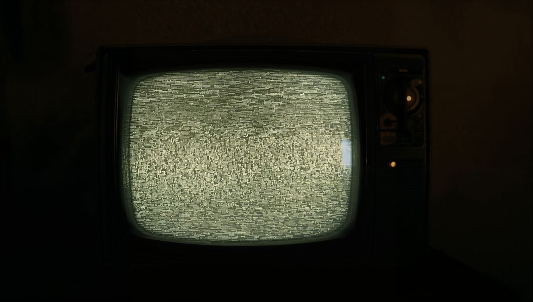 Retro CRT Television with Static in Dimly Lit Room