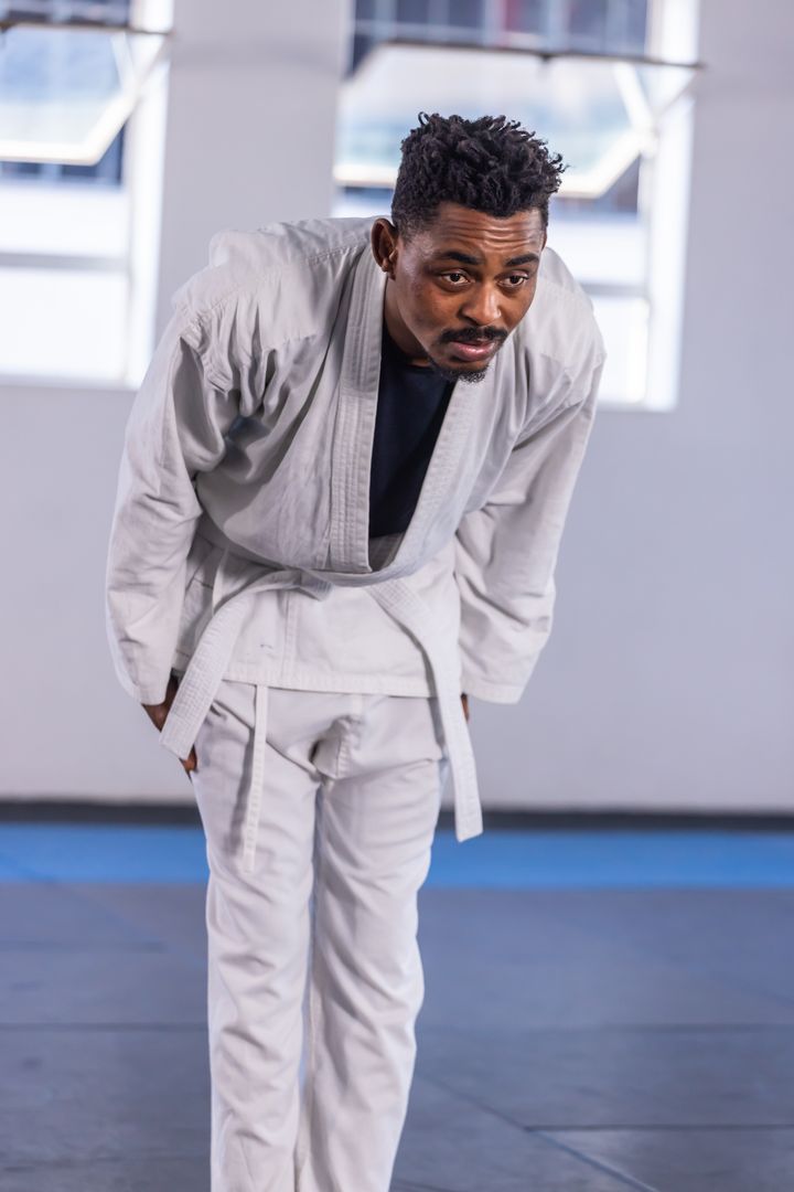 Martial Artist Bowing in Dojo Showing Respect and Tradition