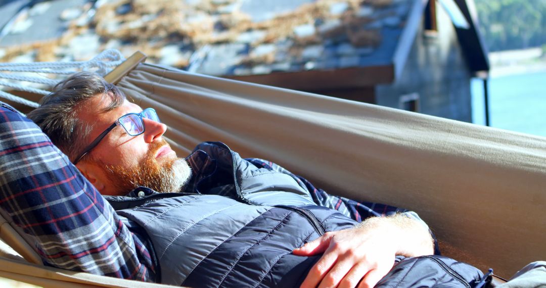 Man Relaxing in Hammock Outdoors on Sunny Day - Free Images, Stock Photos and Pictures on Pikwizard.com