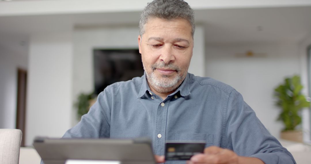 Middle-aged Man Shopping Online With Tablet and Credit Card - Free Images, Stock Photos and Pictures on Pikwizard.com