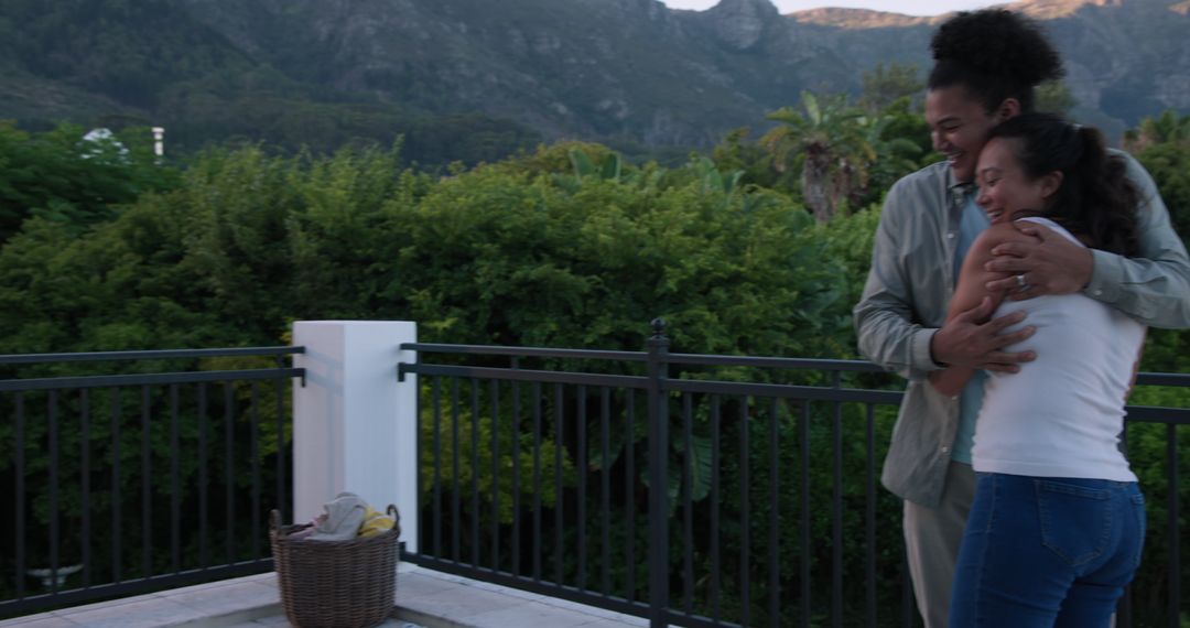 Joyful Couple Embracing on Scenic Balcony with Bananas