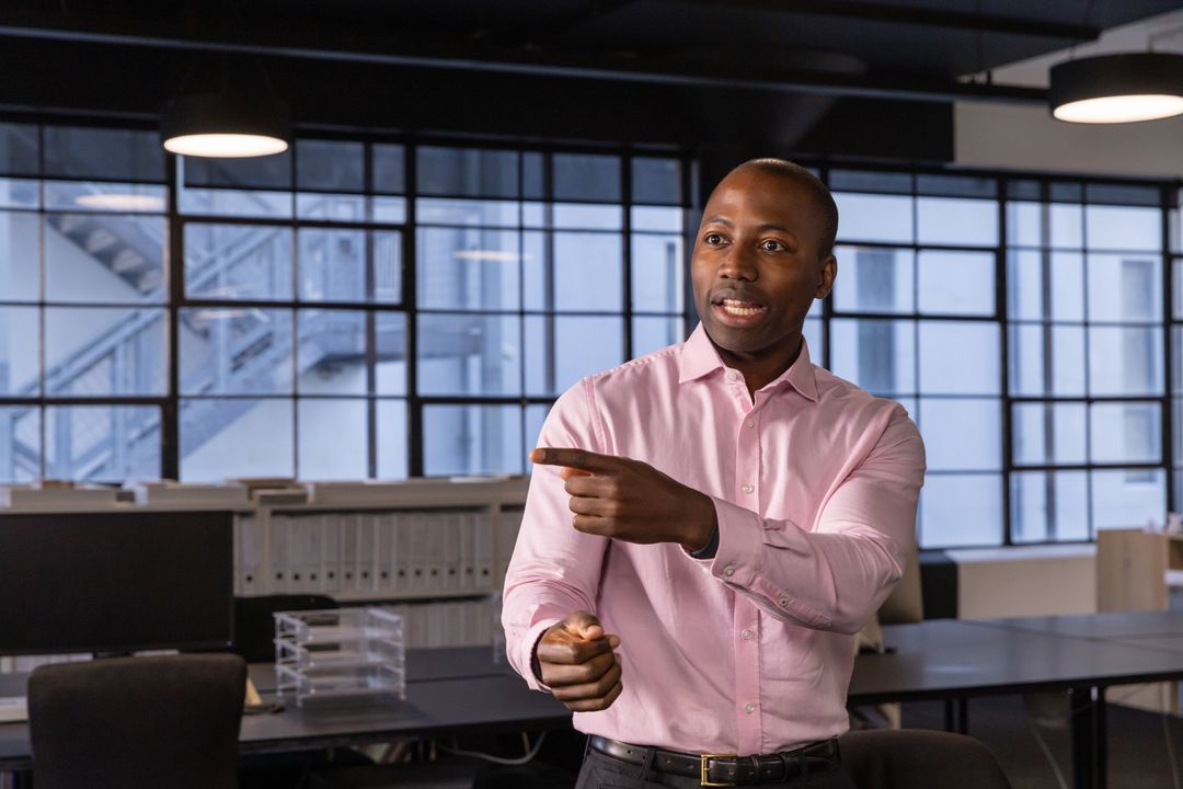 African American Professional Presenting in Modern Office Setting