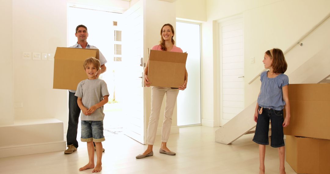 Family Moving into New Home Carrying Boxes - Free Images, Stock Photos and Pictures on Pikwizard.com