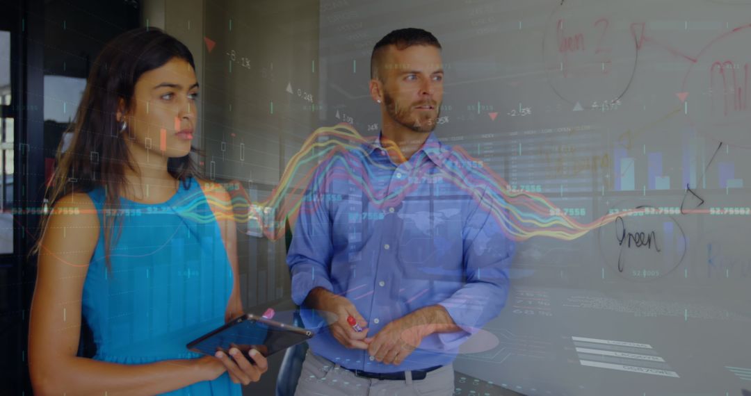 Business Professionals Analyzing Financial Graphs on Glass Panel