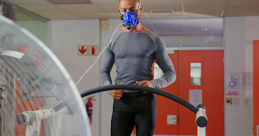 Athlete Undergoing Fitness Test on Treadmill with Respiratory Mask in Laboratory - Free Images, Stock Photos and Pictures on Pikwizard.com