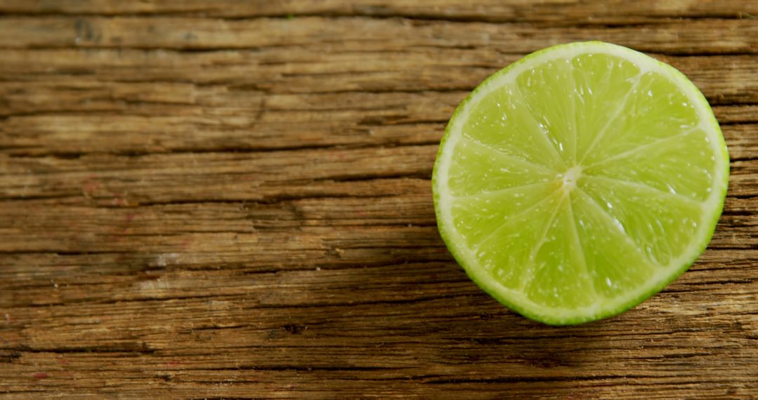 Close-up of Halved Lime on Rustic Wooden Table - Free Images, Stock Photos and Pictures on Pikwizard.com