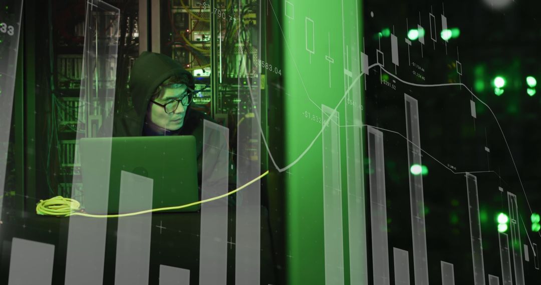 Hacker Analyzing Digital Data on Laptop in Dark Room