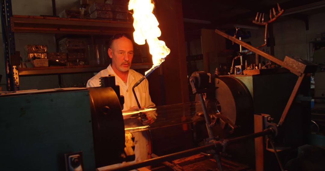 Male Worker Using Blowtorch for Glasscrafting in Factory - Free Images, Stock Photos and Pictures on Pikwizard.com